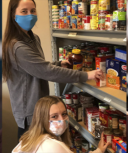 Pictured_ Stocking the Food Pantry